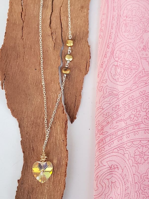 crystal heart silver chain necklace displayed